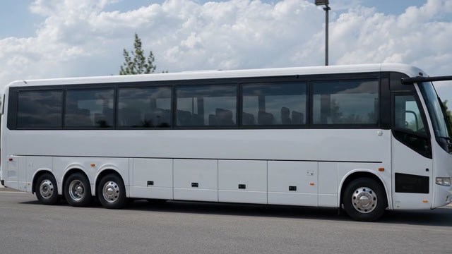 3 axles, 12 wheels White Coach Bus